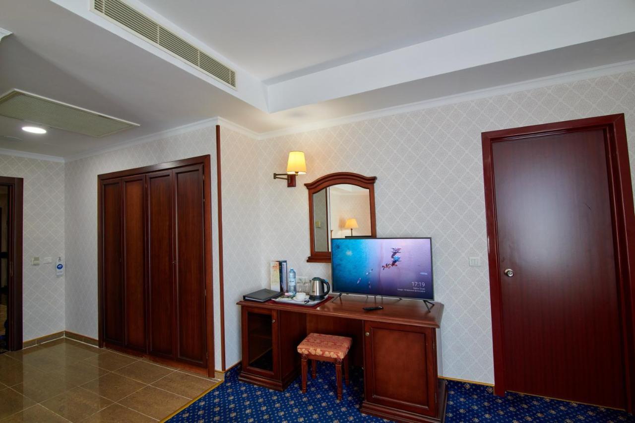 Grand Hotel Victory Актау Екстериор снимка A room at the hotel