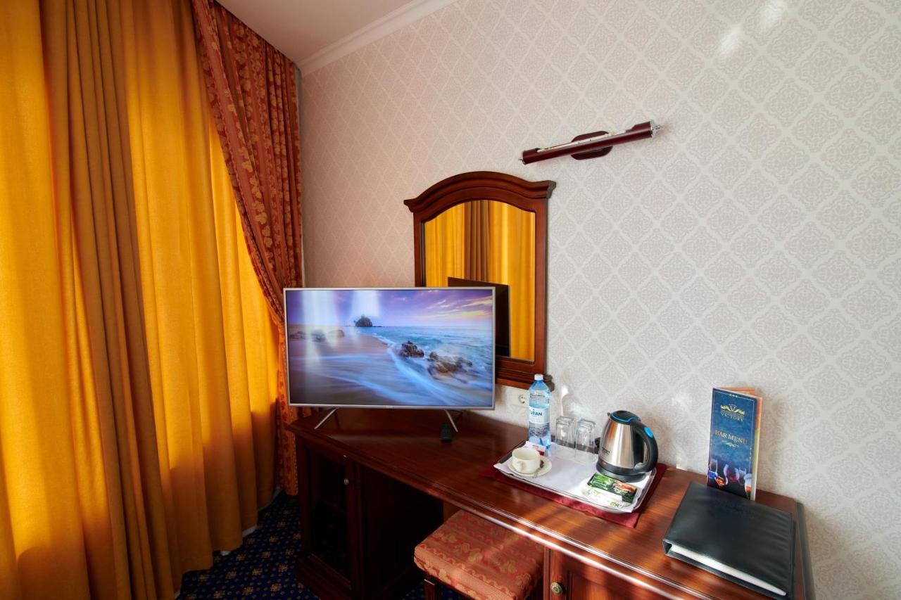 Grand Hotel Victory Актау Екстериор снимка A room at the hotel