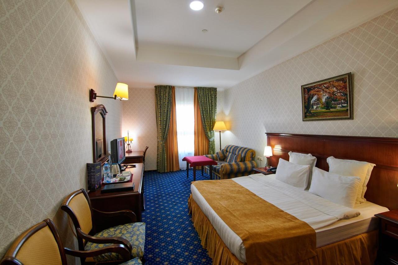 Grand Hotel Victory Актау Екстериор снимка A room at the hotel